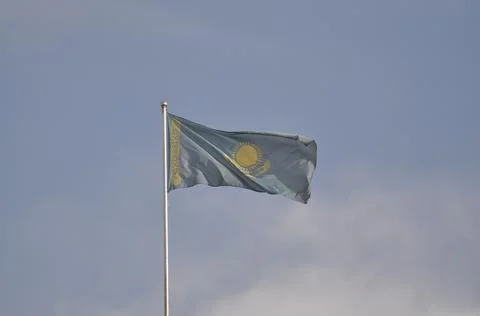The flag of Kazakhstan develops in the wind Stock Photos