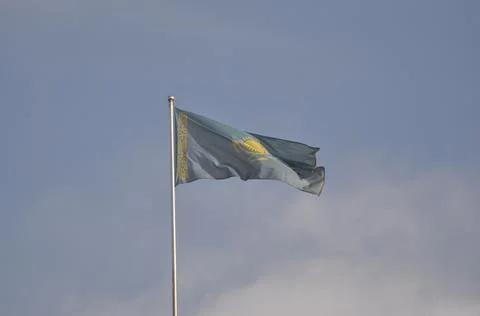 The flag of Kazakhstan develops in the wind Stock-Fotos