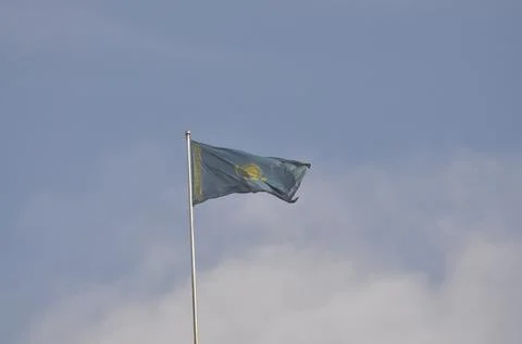 The flag of Kazakhstan develops in the wind Stock Photos