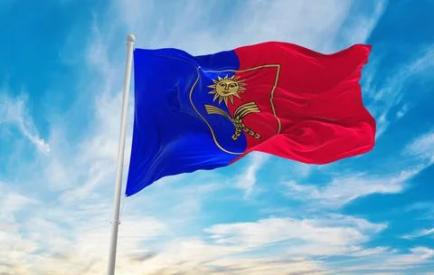 Flag of Khmelnytskyi region , Ukraine at cloudy sky background on sunset, pan Stock Illustration