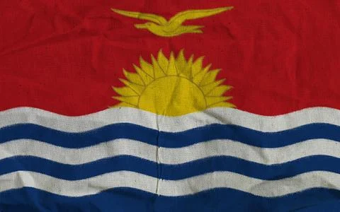 Flag of Kiribati Featuring Waves, Sun, and Bird on Textured Fabric Background Stock Photos