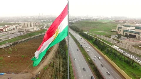 The Flag of Kurdistan, where it was hoisted by thousands of Kurdish Stock Footage 146759977