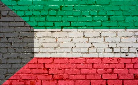 Flag of Kuwait painted on brick wall, background texture Stock Photos
