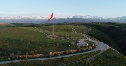 Flag of Kyrgyzstan on a hill Stock Footage 115064102
