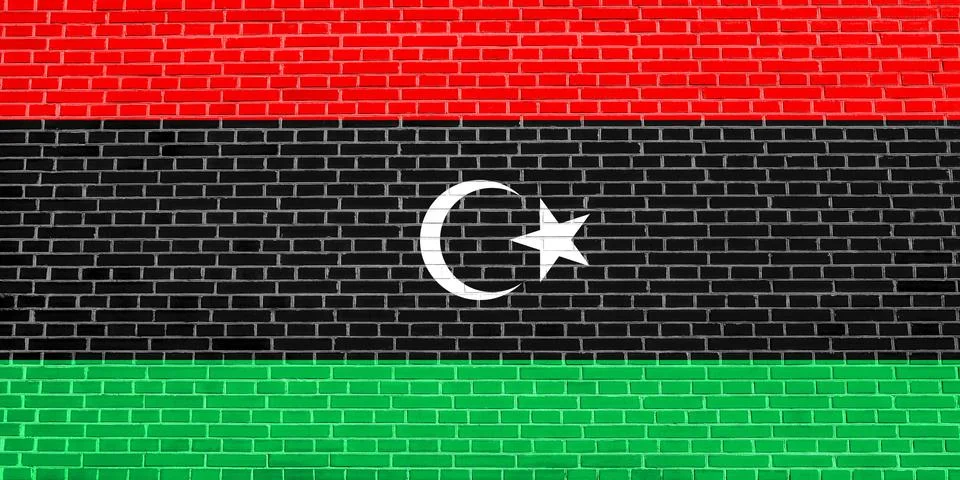 Flag of Libya on brick wall texture background Stock Photos