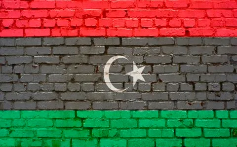 Flag of Libya painted on brick wall, background texture Stock Photos