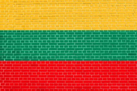 Flag of Lithuania on brick wall texture background. Lithuanian national flag. Illustrazione stock