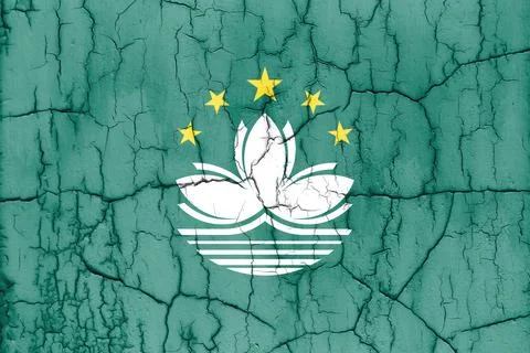Flag of Macau on cracked wall, textured background. Stock Photos