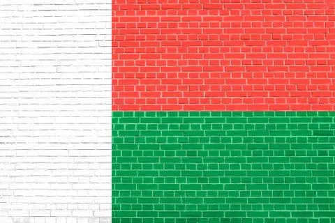 Flag of Madagascar, brick wall texture background Stock Photos