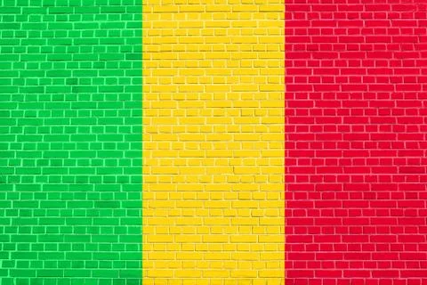 Flag of Mali on brick wall texture background Stock Photos