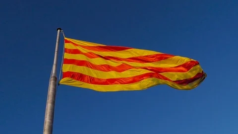 The flag of Malta flies against the background of a bright blue sky. Island Stock Footage 101199555