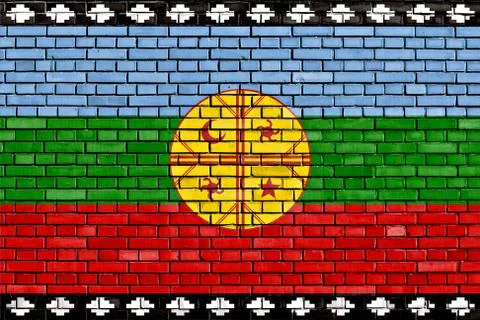 Flag of Mapuche painted on brick wall Stock Photos