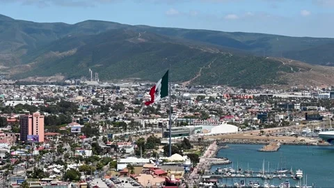 The flag of Mexico in the central zone of Ensenada against the backdrop of a Stock Footage 244672145