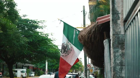 Flag of Mexico with fabric structure against a cloudy sky. Street view Stock Footage 167916697