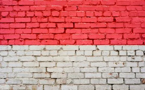 Flag of Monaco painted on brick wall, background texture Stock Photos
