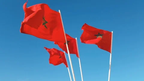 Flag of Morocco waving against blue sky Video stock 97779063