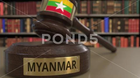 Flag of Myanmar on falling judges gavel in court. National justice or ...