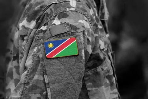 Flag of Namibia on soldiers arm. Namibia flag on military uniform. Army, troo Stock Photos