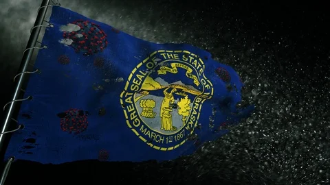 The flag of Nebraska is torn and marked with the virus of covid-19 . Stock-Footage 127198541