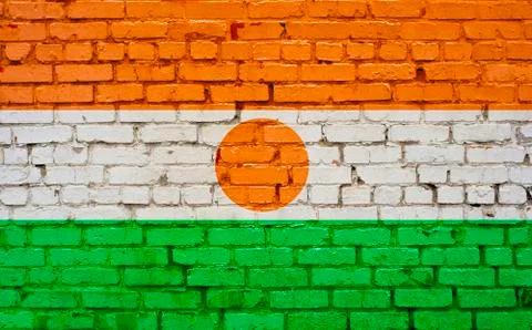 Flag of Niger painted on brick wall, background texture Stock Photos