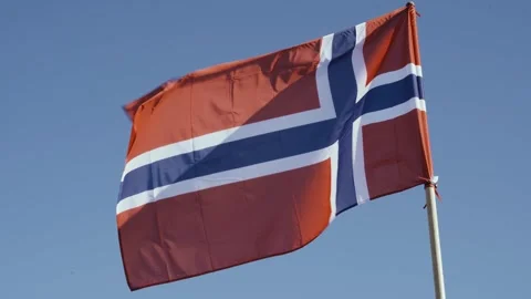 Flag of Norway, develops against the blue sky. Video stock 250443126
