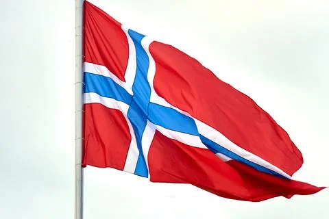 The flag of Norway hangs on the flagpole Stock Photos