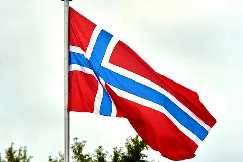 The flag of Norway hangs on the flagpole Stock Photos