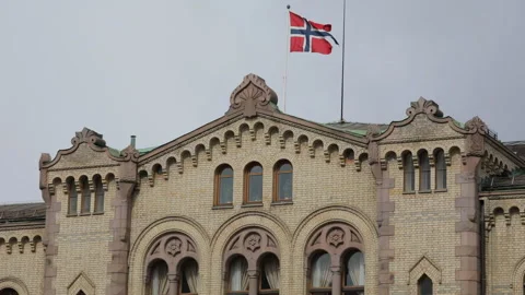 Flag of Norway waving above Storting building in Oslo, Norway Stock Footage 107883510