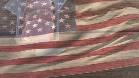 Flag overlay waving, hand lifting tray lid and placing raw steaks on wooden Stock Footage 310283946