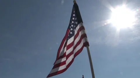 Flag Pan to Old Tractor Stock Footage 36278345