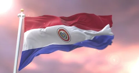 Flag of Paraguay waving at wind at sunset in slow, loop Video stock 93126355
