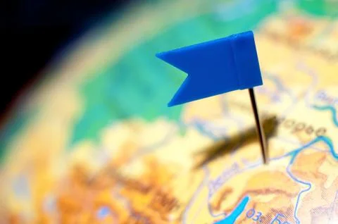 Flag pin on the globe Stock Photos
