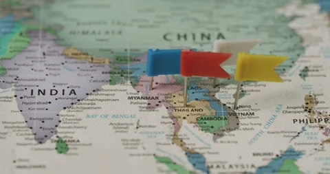 Flag pins marking locations on a Southeast Asia world map Stock Footage 345589512