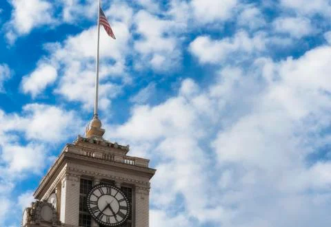 Flag Pole on Top of Clock Tower Stock Photos