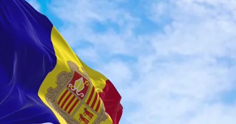 Flag of the Principality of Andorra waving in the wind on a clear day. Stock Footage 288326465