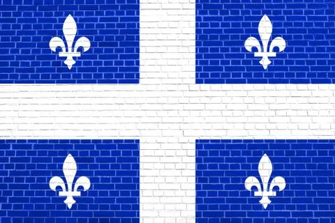 Flag of Quebec on brick wall texture background Stock Photos