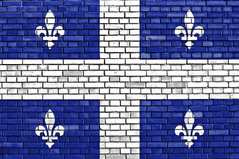 Flag of Quebec painted on brick wall Stock Illustration