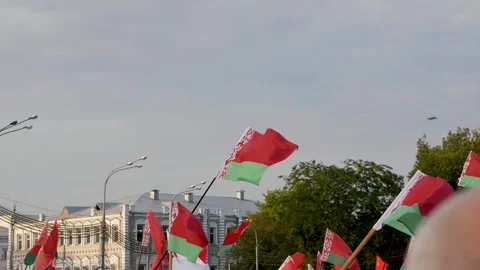 Flag of Republic of Belarus against background of building and sky Stock Footage 297296578