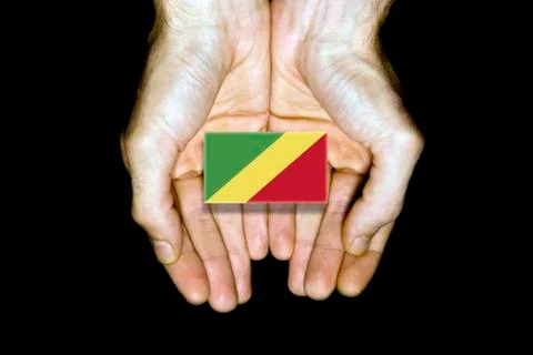 Flag of Republic of the Congo in hands on black background Stock Illustration