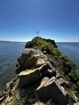 Flag on the rocks Foto stock