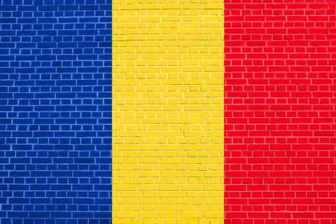 Flag of Romania on brick wall texture background Stock Photos