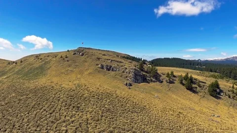 Flag of Romania on top of the mountain Stock Footage 75944265