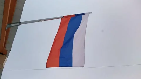 Flag of Russia develops against the blue sky Video stock 167585546