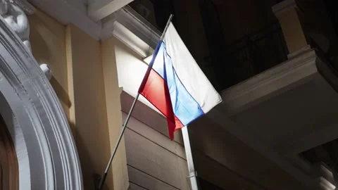 Flag of Russian Federation develops in wind at night on administrative building. Stock Footage 172254548