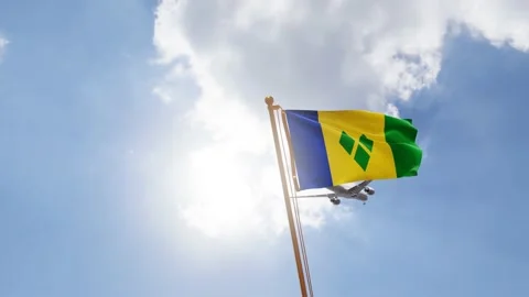 Flag of Saint Vincent and Grenadines Waving with Airplane arriving or departing Stock Footage 139205185