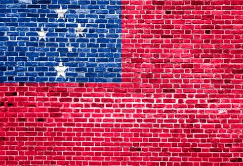 Flag of Samoa painted on brick wall, background texture Stock Photos