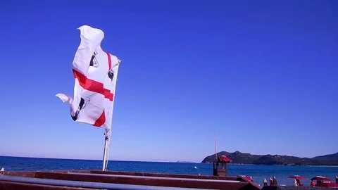 Flag Sardegna blue sky Stock Footage 76272087