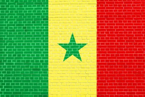 Flag of Senegal on brick wall texture background Stock Photos