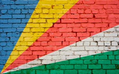 Flag of Seychelles painted on brick wall, background texture Stock-Fotos