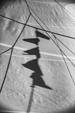 Flag shadow on sailing boat sails Stock Photos
